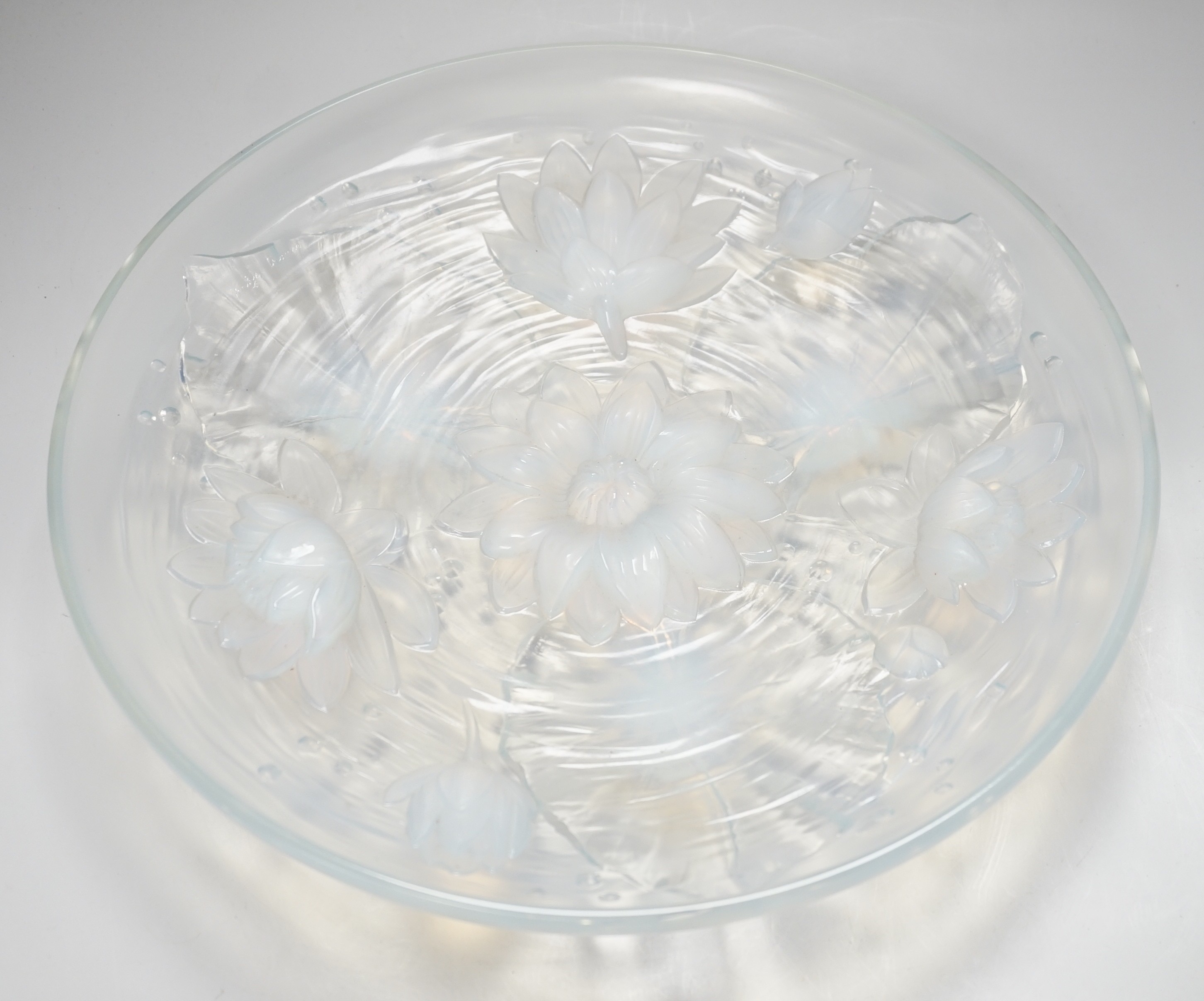 A Verlys opalescent glass dish with flower decoration. 35cm diameter